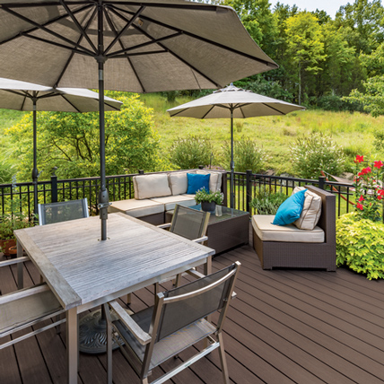 Deck with patio furniture and umbrellas. 