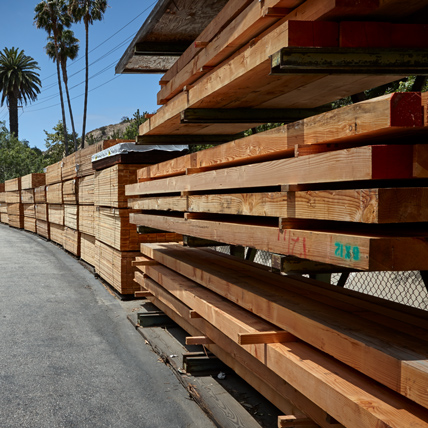 Close up of a row of lumber in Ganahl lumberyard.